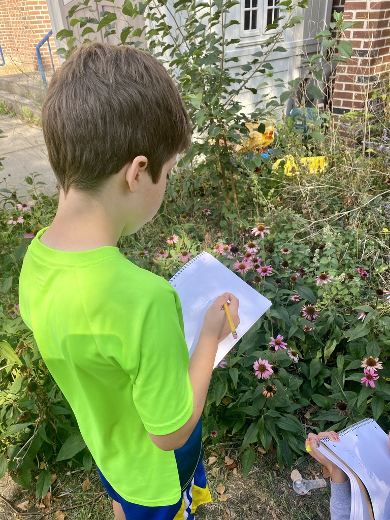 4th graders explored nature with magnifying glasses and recorded their observations! It was a beautiful day for outdoor learning.